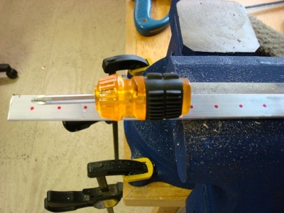 Use a punch (or a screwdriver) to dimple marks