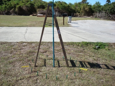 Using a ladder to steady the center pole