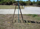 Using a ladder to steady the center pole
